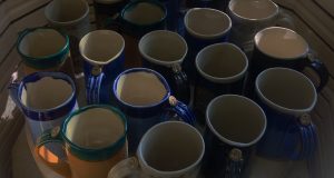Kelley Mikel, ceramic mugs in kiln