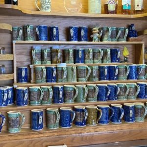Mikel Kelley's mugs on display at Grumpy Troll