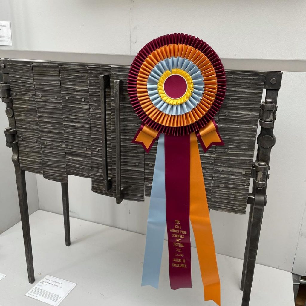 Luke Proctor wins award for his metal work at Winter Park Sidewalk Art Festival